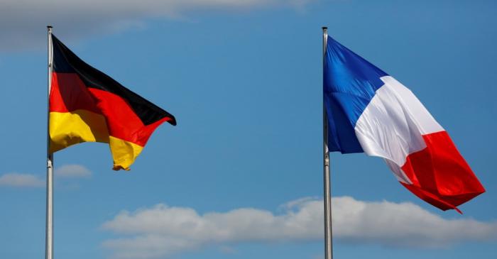 FILE PHOTO: The flags of Germany and France are seen in front of the the Chancellery, before