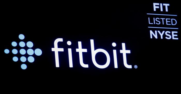 FILE PHOTO: The logo for wearable device maker Fitbit Inc. is displayed on a screen at NYSE