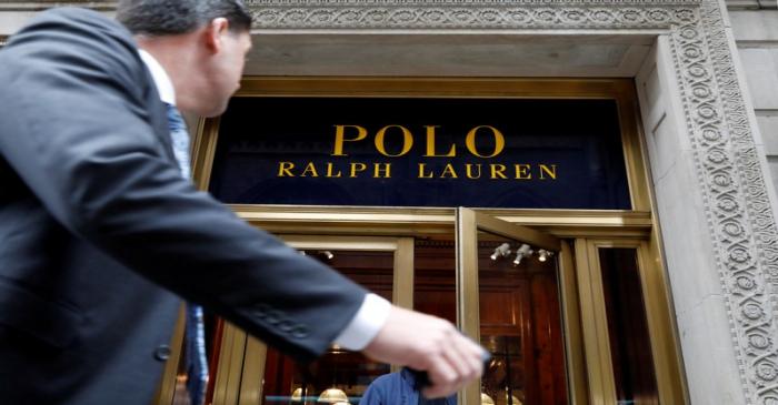 FILE PHOTO: A man walks past Ralph Lauren Corp.'s  flagship Polo store on Fifth Avenue in New