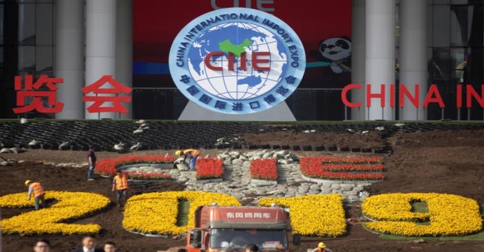 FILE PHOTO: Workers set up the venue for the second China International Import Expo in Shanghai