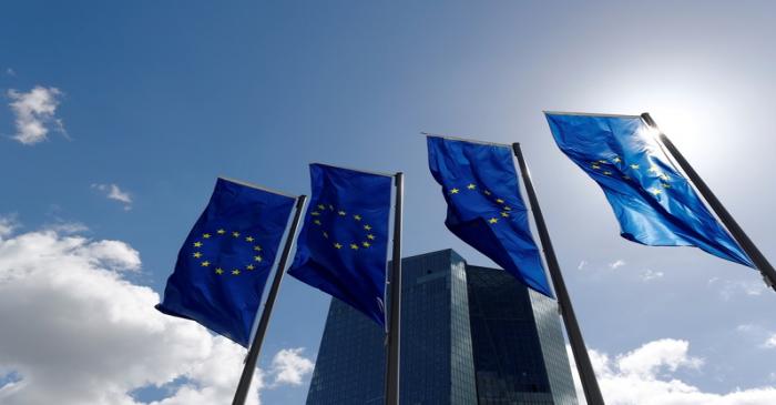FILE PHOTO: European Union flags flutter outside the European Central Bank (ECB) headquarters