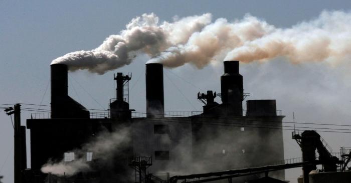 FILE PHOTO: Smoke billows from a factory on the outskirts of Shenyang