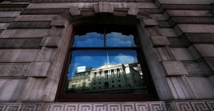 FILE PHOTO: The Bank of England is reflected in a window in the City of London