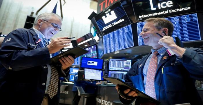 Traders work on the floor at the NYSE in New York