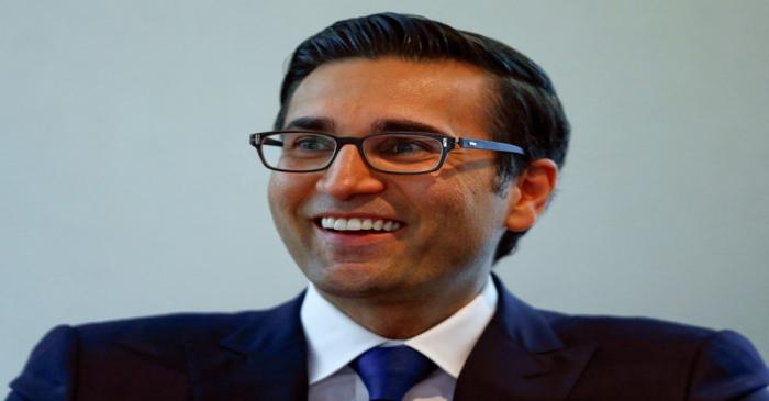 FILE PHOTO: Khan, CEO International Wealth Management of Swiss bank Credit Suisse, smiles