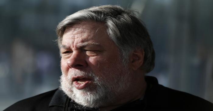 Steve Wozniak, co-founder of Apple, talks to people during a launch event in Cupertino