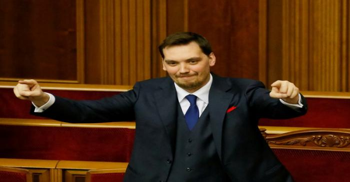 Ukrainian Prime Minister Oleksiy Honcharuk reacts after lawmakers voted to remove a ban on the