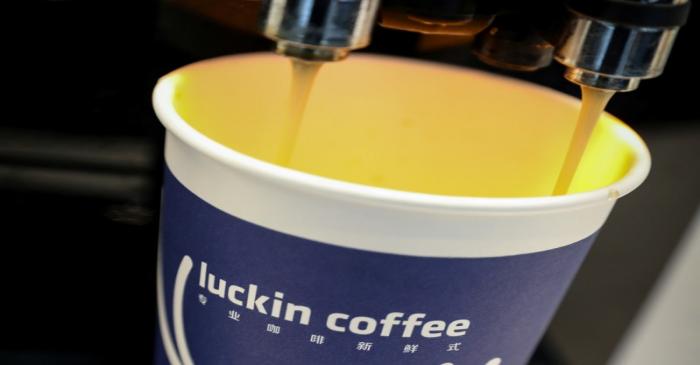 A cup of 'Luckin Coffee,' coffee is poured during the company's IPO at the Nasdaq Market site