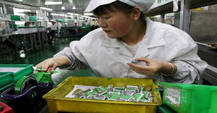FILE PHOTO: Employee works at a production line of lithium ion batteries inside a factory in