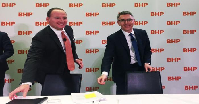 BHP Chairman Ken MacKenzie and Mike Henry are seen at a news conference to announce Henry as