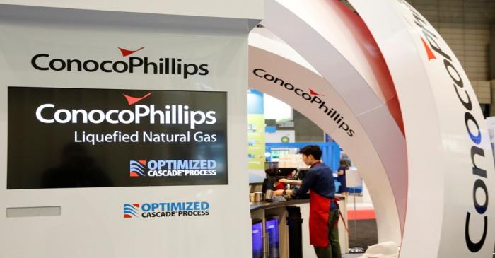 Logos of ConocoPhillips are seen in its booth at Gastech, the world's biggest expo for the gas