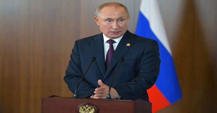 Russian President Vladimir Putin speaks at a news conference after the BRICS summit in Brasilia