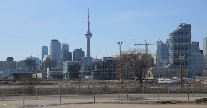 The downtown skyline and CN Tower are seen past the eastern waterfront area of Toronto