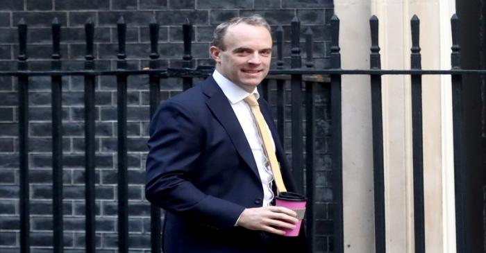 Britain's Foreign Secretary Dominic Raab walks outside Downing Street in London