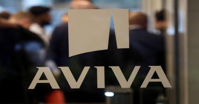 FILE PHOTO: A logo sits on the window of the Aviva head office in the city of London