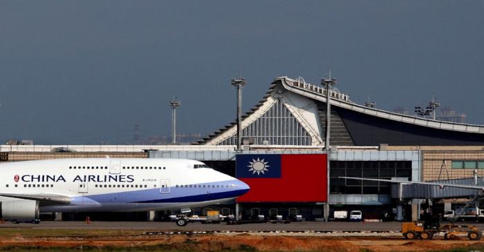 FILE PHOTO: A China Airlines Boeing 747 passenger plane takes off near a Taiwanese national