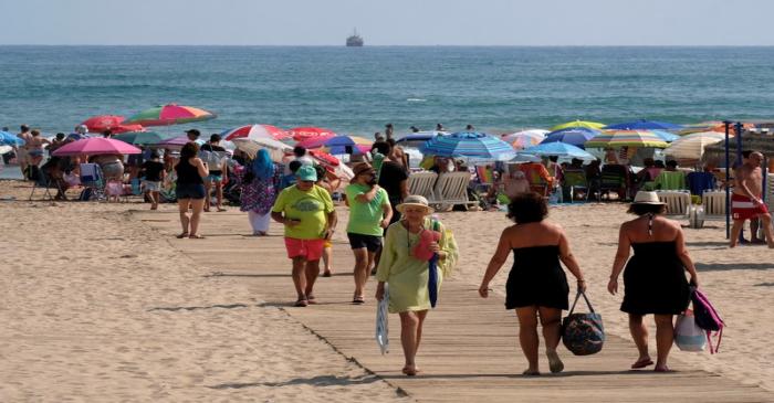 Beachgoers gather on the eastern coast to enjoy the last days of the summer season in Gandia