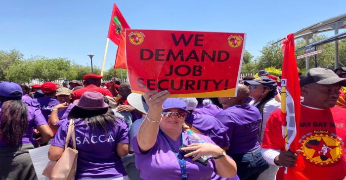 FILE PHOTO: Workers of South African Airways (SAA) hold placards during a strike over wages and