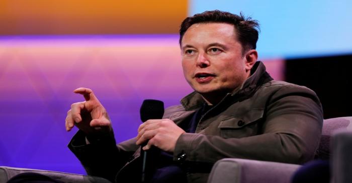Tesla CEO Elon Musk gestures during a conversation at the E3 gaming convention in Los Angeles