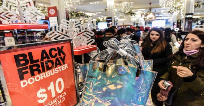 FILE PHOTO: People shop during a Black Friday sales event at Macy's flagship store in New York