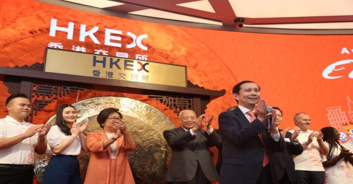 Daniel Zhang, Laura Cha and Tung Chee-hwa attend Alibaba Group's listing ceremony at the Hong