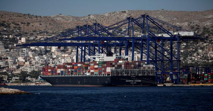 A cargo ship is moored at the Piraeus Container Terminal, near Athens