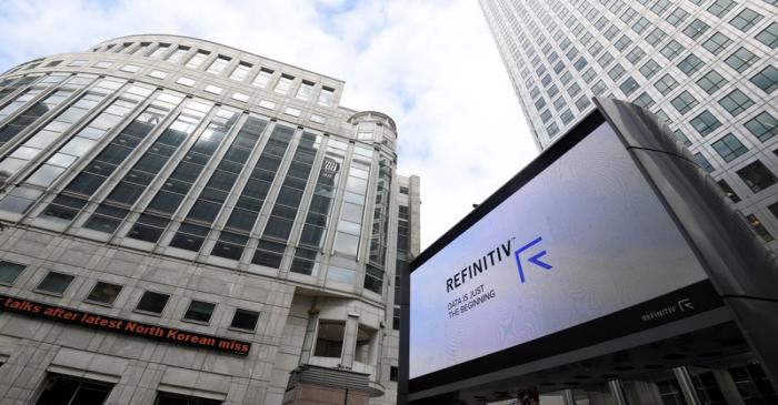 FILE PHOTO: The Refinitiv logo is seen on a large screen in Canary Wharf in London