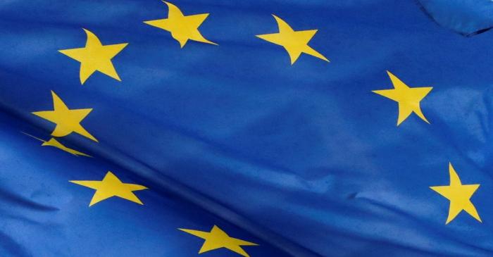 A European flag is seen outside the EU Commission headquarters in Brussels