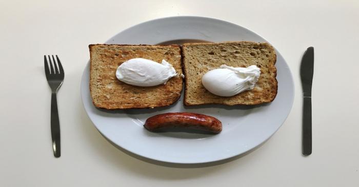 FILE PHOTO: A breakfast of sausage, eggs and toast is pictured in an office canteen in London
