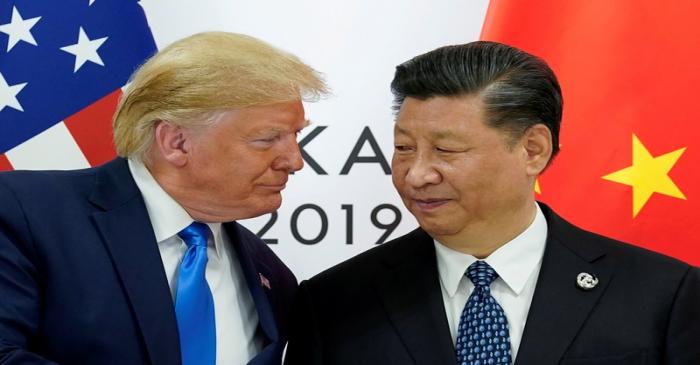 FILE PHOTO: Trump meets Xi at the G20 leaders summit in Osaka, Japan