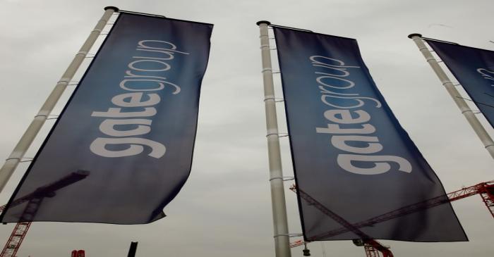 Flags of airline caterer Gategroup fly at the facility of their Gate Gourmet division at Zurich