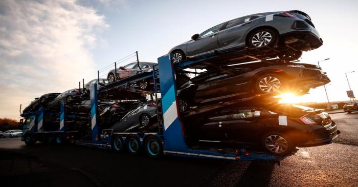 A lorry with car carrier trailer leaves the Honda car plant in Swindon