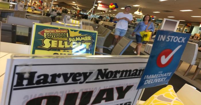 Shoppers walk the furniture showroom at a Harvey Norman outlet in Sydney