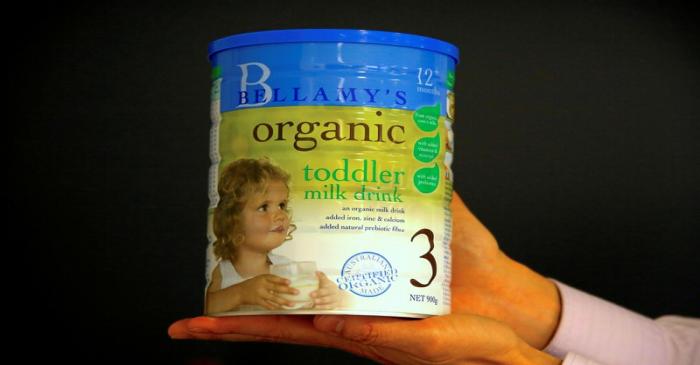 FILE PHOTO: A person holds a tin of Bellamy's organic toddler milk formula in Sydney