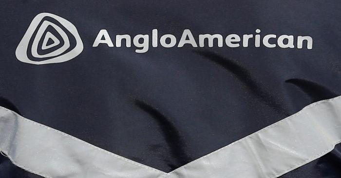 Logo of Anglo American is seen on a jacket of an employee at the Los Bronces copper mine, in