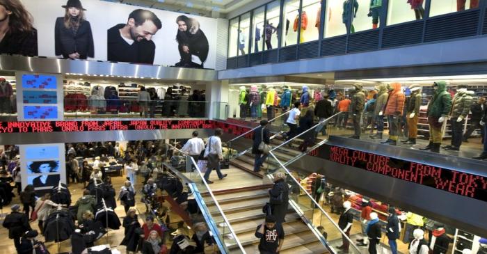 File photo of customers shopping inside the Paris flagship Uniqlo Japanese fashion store