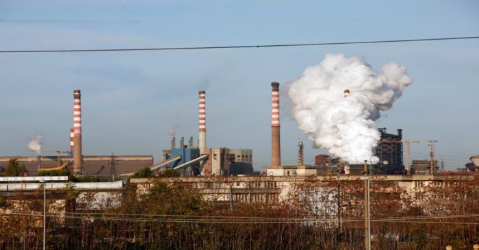 FILE PHOTO: Steam comes out of the chimneys of the Ilva steel plant in Taranto