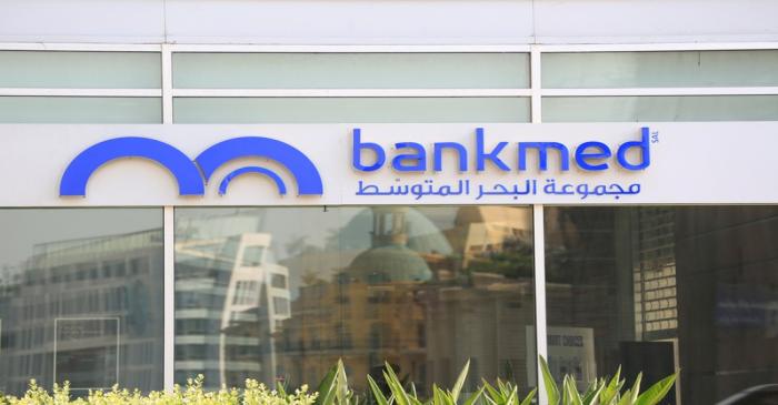 A bank sign is seen outside a Bankmed branch in downtown Beirut