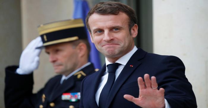 French President Emmanuel Macron and NATO Secretary General Jens Stoltenberg leave after a
