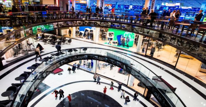 FILE PHOTO:  People walk through Mall of Berlin shopping centre during its opening night in