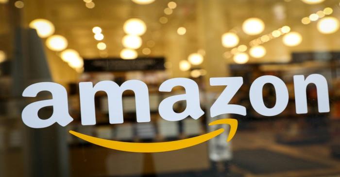 FILE PHOTO: The logo of Amazon is seen on the door of an Amazon Books retail store in New York