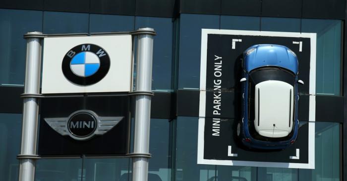 FILE PHOTO: A Mini car is fixed onto a wall at a BMW and Mini dealership in Barcelona