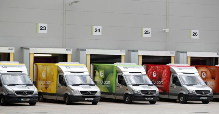 FILE PHOTO: Delivery vans are lined up prior to dispatch at the Ocado CFC (Customer Fulfilment