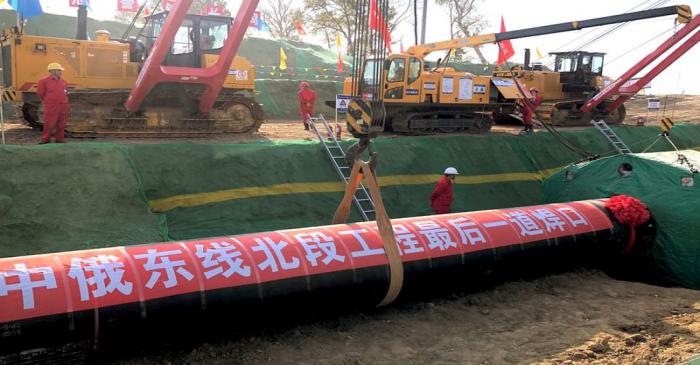 FILE PHOTO: Workers are seen at the construction site of a natural gas pipeline as part of