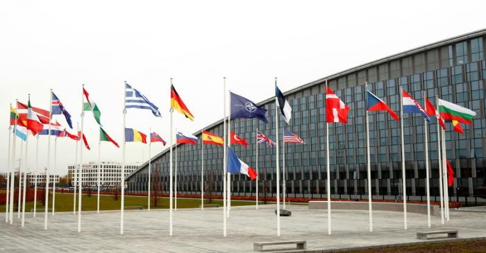 Flags of NATO member countries are seen at the Alliance headquarters in Brussels