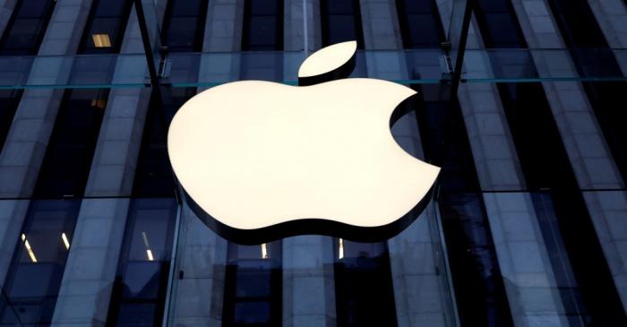 FILE PHOTO: The Apple Inc. logo is seen hanging at the entrance to the Apple store on 5th