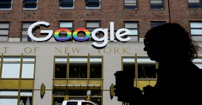 FILE PHOTO: People pass by an entrance to Google offices in New York
