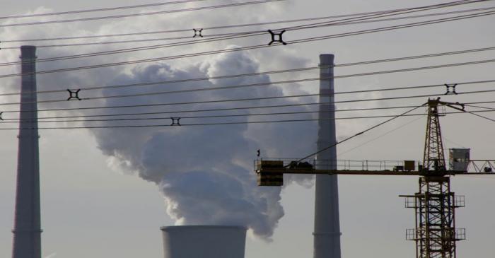 FILE PHOTO: A coal-fired power plant is pictured near a construction site in Beijing