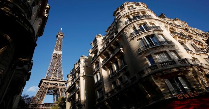 FILE PHOTO: The Eiffel Tower stands near luxury Haussmannian buildings in the 7th