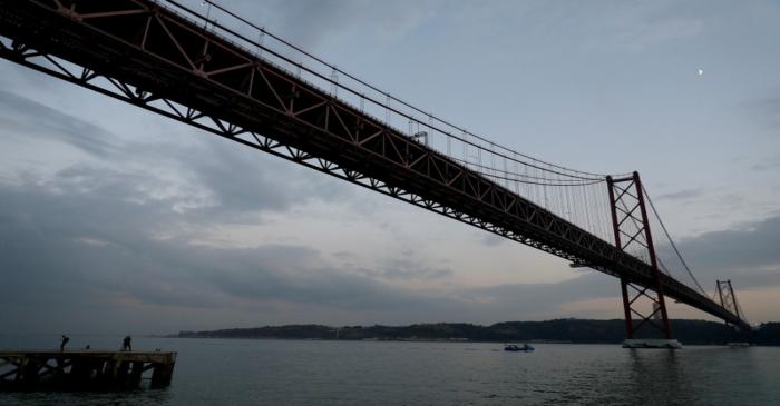View of the 25th April Bridge over the Tagus river in Lisbon